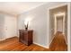 Inviting hallway with polished hardwood floors, and easy access to all areas of the home at 3880 Admiral Dr, Chamblee, GA 30341