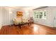 Bright living room with hardwood floors, a cozy sofa, and a rocking chair by the window at 3880 Admiral Dr, Chamblee, GA 30341