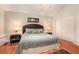 Inviting main bedroom with hardwood floors, a queen bed, and neutral decor at 3880 Admiral Dr, Chamblee, GA 30341