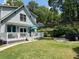 View of home and backyard featuring a patio, lawn, and white railed deck at 158 Delano Dr, Decatur, GA 30032