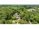 Aerial view of a secluded property surrounded by lush trees in a vibrant, green neighborhood at 1589 Delano Dr, Decatur, GA 30032