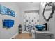 This bathroom offers a vessel sink, a mirror, and blue accents throughout at 1589 Delano Dr, Decatur, GA 30032