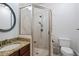 Bathroom featuring walk-in shower, tile surround, and granite vanity at 1589 Delano Dr, Decatur, GA 30032
