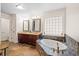 Luxurious bathroom showcasing a soaking tub, double vanity, and stylish tile work at 1589 Delano Dr, Decatur, GA 30032