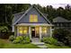 Beautiful home with a charming front porch, landscaped yard, and inviting exterior lighting at 1589 Delano Dr, Decatur, GA 30032