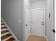 Hallway with 2 white doors, leading to other parts of the home at 1589 Delano Dr, Decatur, GA 30032