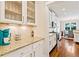 Modern kitchen with white cabinets, granite countertops, and stainless steel appliances at 1589 Delano Dr, Decatur, GA 30032