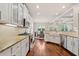 Spacious kitchen with white cabinetry, granite countertops, and stainless steel appliances at 1589 Delano Dr, Decatur, GA 30032