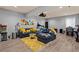 Finished basement living room with sectional sofa, projector, and movie-themed decor at 1589 Delano Dr, Decatur, GA 30032