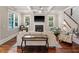Spacious living room with coffered ceilings, fireplace, and large windows at 1589 Delano Dr, Decatur, GA 30032