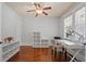 Sun-filled office space with a ceiling fan, desk and ample storage at 1589 Delano Dr, Decatur, GA 30032