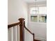 Staircase features white wood and dark wood with modern pendant lighting at 1589 Delano Dr, Decatur, GA 30032