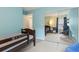 Inviting bedroom with blue accent wall, bed, dresser, and natural light at 163 Silver Fox Trail Trl, Dallas, GA 30157