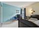 Inviting bedroom with blue accent wall, bed, dresser, and natural light at 163 Silver Fox Trail Trl, Dallas, GA 30157