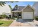 Charming home exterior with a well-manicured lawn and a private driveway at 163 Silver Fox Trail Trl, Dallas, GA 30157