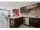 The kitchen has laminate countertops, stainless steel appliances and easy access to backyard dining at 163 Silver Fox Trail Trl, Dallas, GA 30157