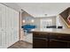 Open-concept living area featuring hardwood floors, fireplace, and adjacent kitchen with granite countertops at 163 Silver Fox Trail Trl, Dallas, GA 30157