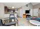 Bright, open-concept living area flows into kitchen with modern appliances and backyard access at 163 Silver Fox Trail Trl, Dallas, GA 30157