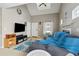 Spacious living room with vaulted ceiling, lots of light, and seamless access to dining and kitchen at 163 Silver Fox Trail Trl, Dallas, GA 30157
