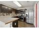 Updated kitchen features stainless steel appliances, modern backsplash, and ample counter space at 163 Silver Fox Trl, Dallas, GA 30157