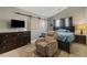Spacious main bedroom featuring a vaulted ceiling, a slider, and a comfortable reclining chair at 163 Silver Fox Trl, Dallas, GA 30157