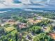 Beautiful aerial view shows the home's location near a lake, with lush greenery, and new home construction in the area at 2980 Beards Rd, Buford, GA 30518