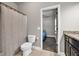 Bathroom featuring a decorative vanity and an open doorway to another room at 2980 Beards Rd, Buford, GA 30518