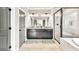 Modern bathroom with dual vanity, granite counters, framed mirrors, and walk-in shower at 2980 Beards Rd, Buford, GA 30518