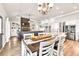Inviting living space featuring granite countertops, stainless steel appliances, stone fireplace, and seating at 2980 Beards Rd, Buford, GA 30518