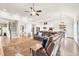 Large living room features a fireplace, stairs to the 2nd floor, view of the kitchen, and luxury vinyl flooring at 2980 Beards Rd, Buford, GA 30518