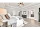Open main bedroom with tray ceilings, wood floors, and neutral wall paint at 2980 Beards Rd, Buford, GA 30518
