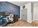 Bright home office with eye catching blue accent wall and lots of room to work at 2980 Beards Rd, Buford, GA 30518