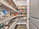 Well-organized walk-in pantry with shelving for ample food storage and kitchen essentials at 2980 Beards Rd, Buford, GA 30518
