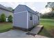 A backyard shed with a ramp on a well-maintained lawn provides secure storage and easy access at 2980 Beards Rd, Buford, GA 30518