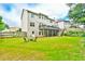 Spacious backyard with well-maintained lawn and patio seating, perfect for outdoor enjoyment at 3060 Mccannon Mill Dr, Dacula, GA 30019