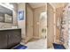 Bathroom features a vanity, mirror, tile floors, and an open doorway leading to another room at 3060 Mccannon Mill Dr, Dacula, GA 30019