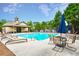 Community pool with lounge chairs, tables, and a nearby recreation building for residents to enjoy at 3060 Mccannon Mill Dr, Dacula, GA 30019