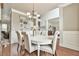 Elegant dining room with hardwood floors, neutral walls, and stylish chandelier at 3060 Mccannon Mill Dr, Dacula, GA 30019