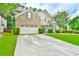Beautiful two-story home showcasing a spacious driveway, brick and siding exterior, and well-kept landscaping at 3060 Mccannon Mill Dr, Dacula, GA 30019