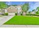 Charming two-story home featuring a manicured lawn, brick facade, and attached two-car garage at 3060 Mccannon Mill Dr, Dacula, GA 30019