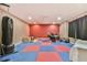 Game room featuring a drum set, punching bag, and padded floors for recreational activities at 3060 Mccannon Mill Dr, Dacula, GA 30019