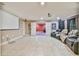 Spacious living room with tile floors, reclining chairs, and a home theater setup with a projector screen at 3060 Mccannon Mill Dr, Dacula, GA 30019