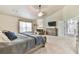 Spacious main bedroom featuring tray ceiling, sitting area, carpet flooring, and a large closet at 3060 Mccannon Mill Dr, Dacula, GA 30019