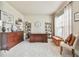 Bright office space with large window, neutral carpet, and built-in shelving, perfect for working at home at 3060 Mccannon Mill Dr, Dacula, GA 30019