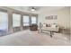 Carpeted upstairs sitting room area provides a versatile space for relaxation and entertainment at 3060 Mccannon Mill Dr, Dacula, GA 30019