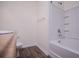 A clean and functional bathroom with modern fixtures and tub with shower at 2326 Bigwood Trl, Atlanta, GA 30349