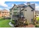 The home has a tiered deck and patio overlooking a lush, green lawn at 2517 Stone Manor Dr, Buford, GA 30519