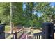 Beautiful backyard with mature trees, a trampoline, and a private, wooded setting at 2517 Stone Manor Dr, Buford, GA 30519