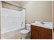 Clean, classic bathroom with a shower-tub combo and a wood vanity at 2517 Stone Manor Dr, Buford, GA 30519