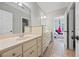 A charming bathroom features tile floors, vanity with cabinets and drawers, and natural light at 2517 Stone Manor Dr, Buford, GA 30519